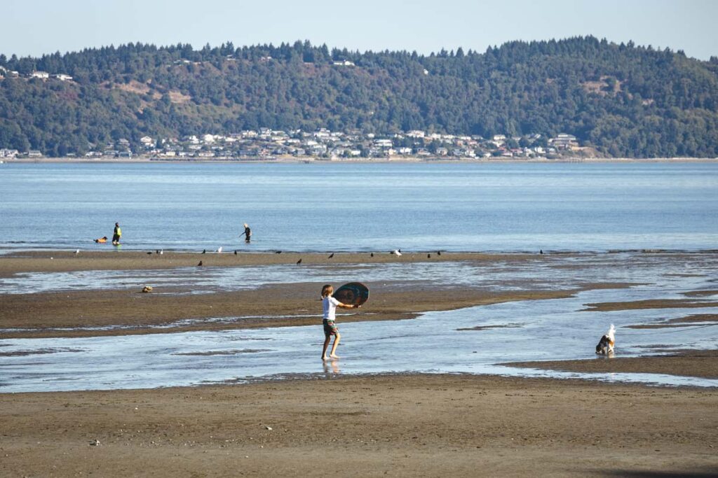 Children playing on Dash Point Beach one of the best Washington state parks