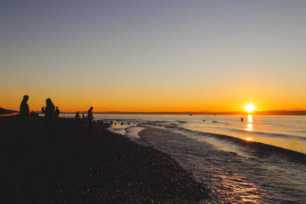 Sunset over the beach at Golden Gardens Park in Settle