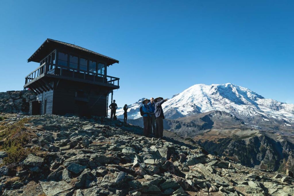 People standing at fire lookout on Mount Fremont, Washington