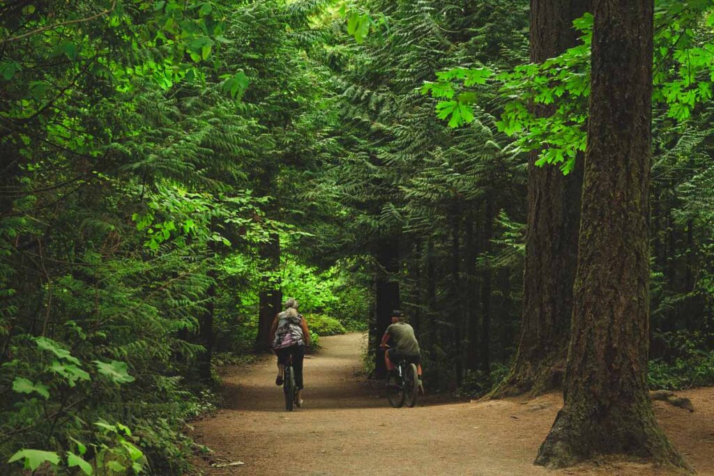 Two cyclists on trail in Lacamas Park