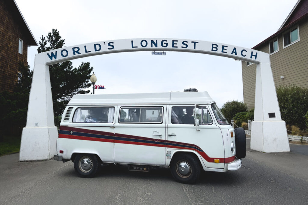 RV under sign for worlds longest beach at Long Beach, Washington