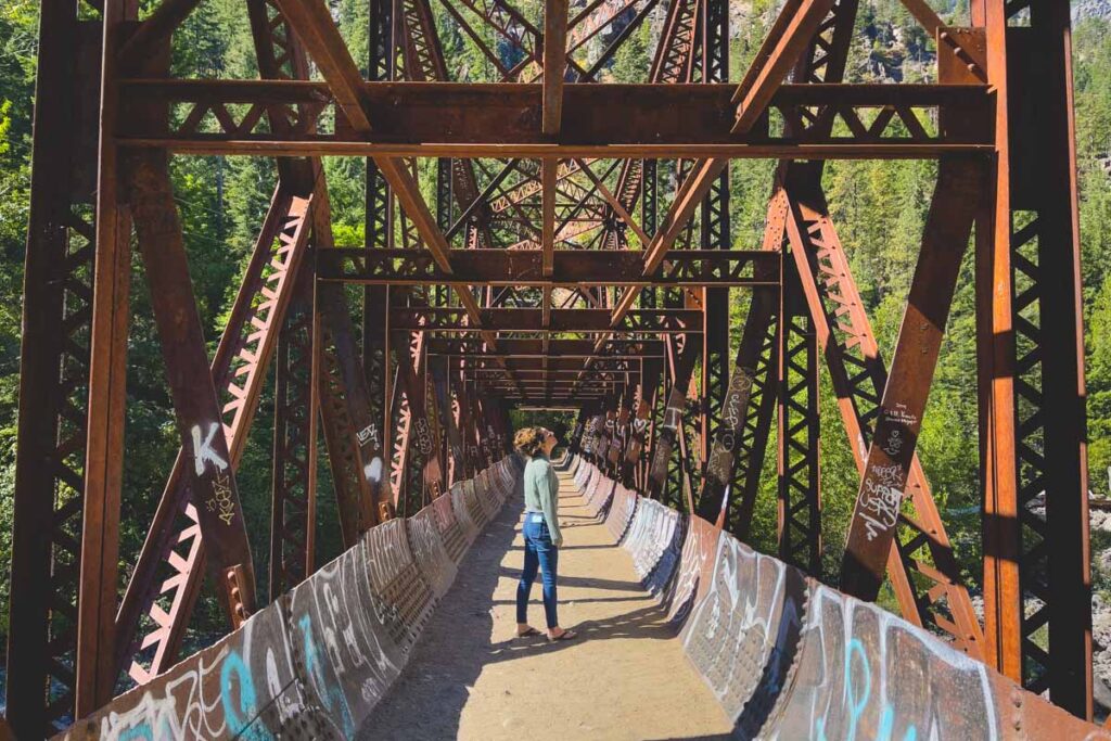 Woman on bridge on the Old Pipeline Bed hike in Washington