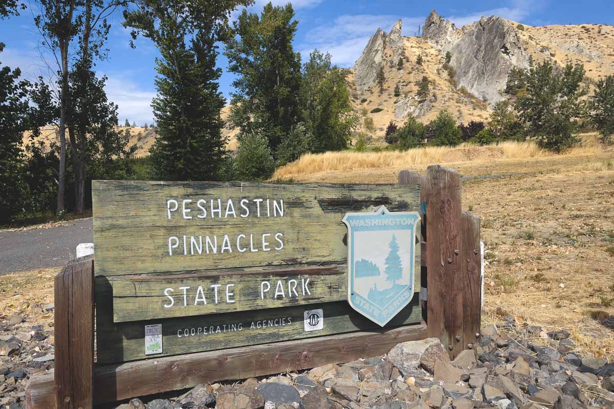 Wooden entrance sign for Peshastin Pinnacles State Park in the mountains near Leavenworth.