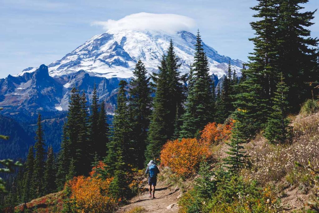 Garrett on a beautiful trail with towering Mount Rainier as a backdrop.