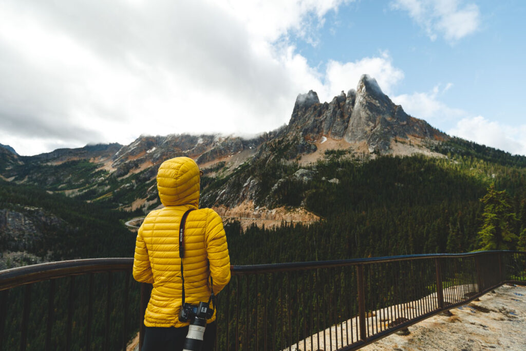 Hiker at Washington Pass Overlook viewpoint one of the best hikes in the North Cascades