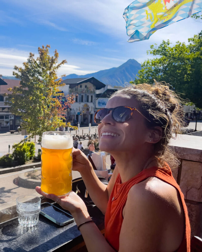 Woman drinking beer for the best weekend getaways from Seattle