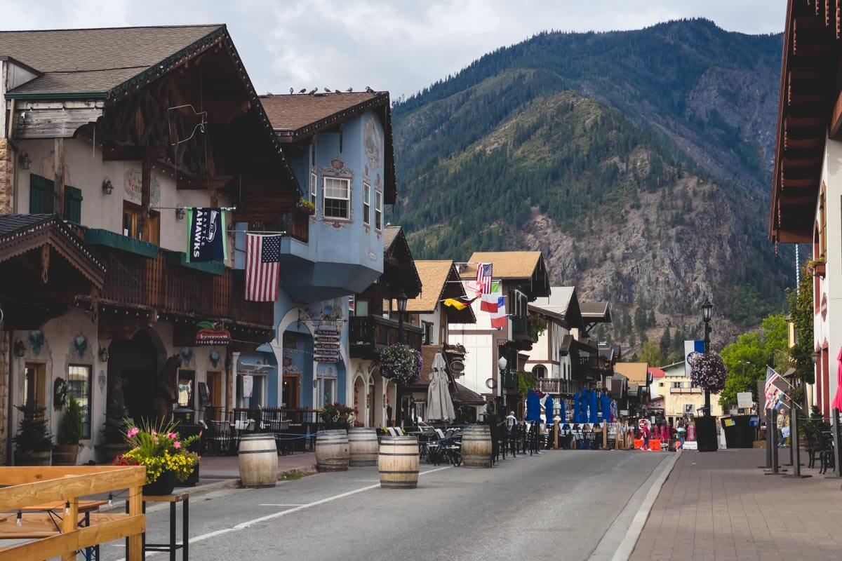 German looking downtown Leavenworth with a backdrop of mountains.