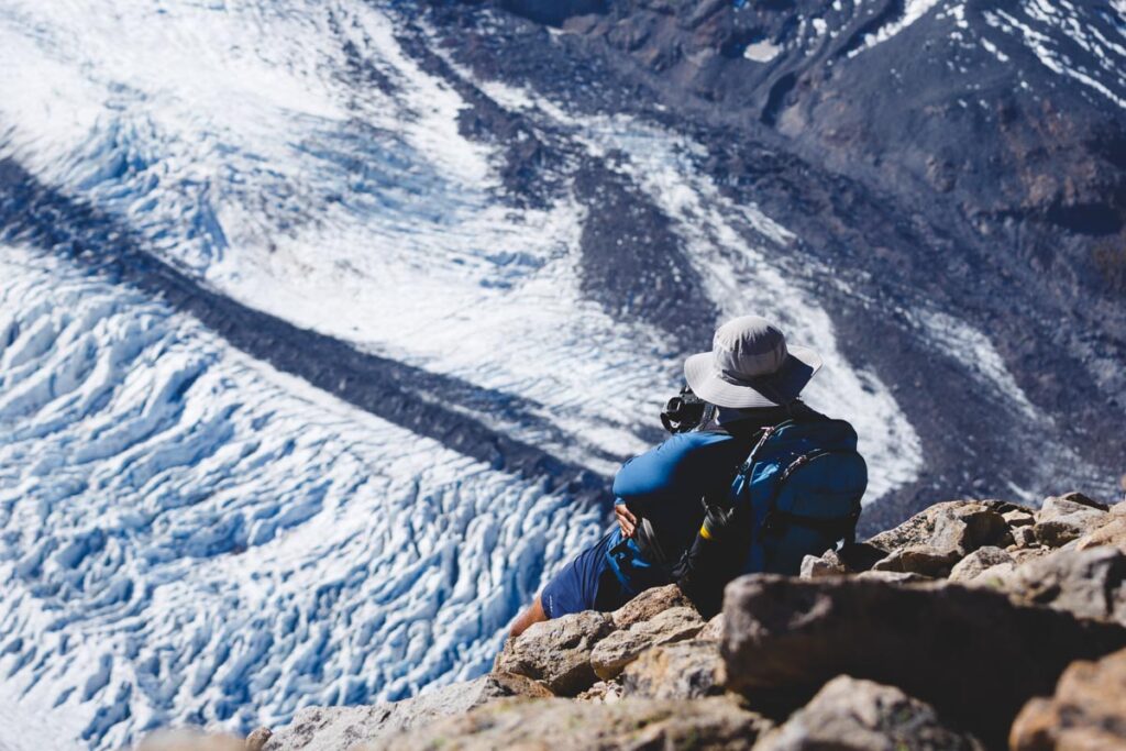 Hiker photographing snow on the Burroughs Mountain Trail