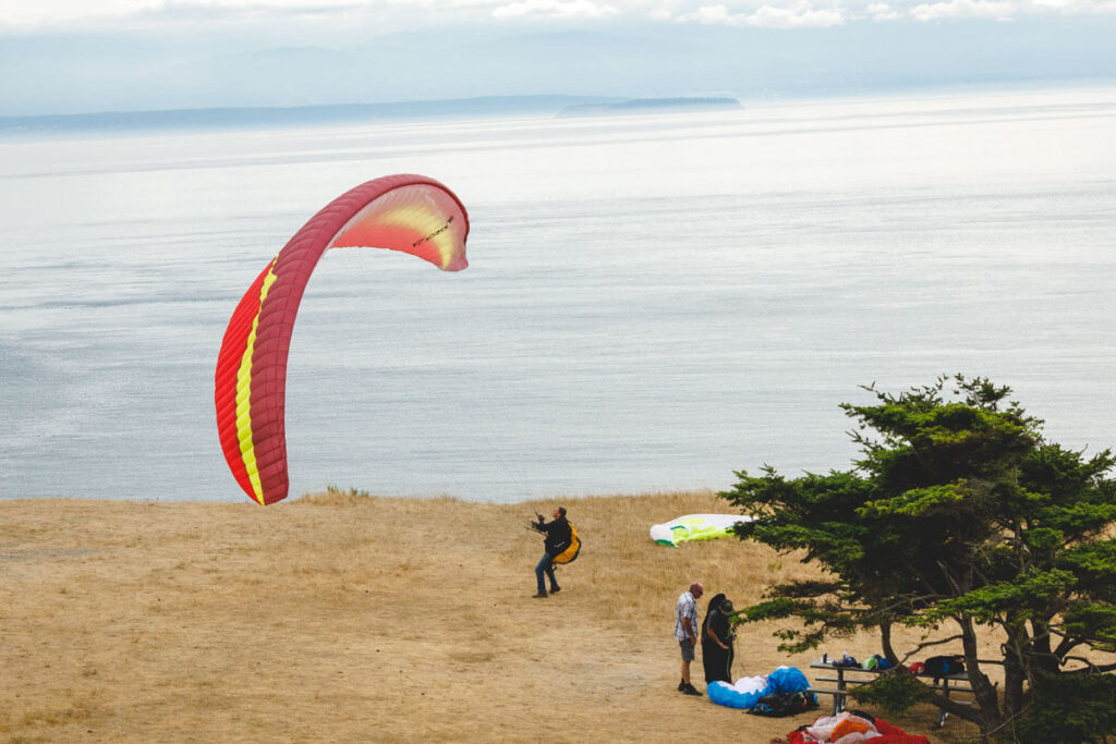 Paragliding at Fort Ebey State Park is one of the best day trips from Seattle