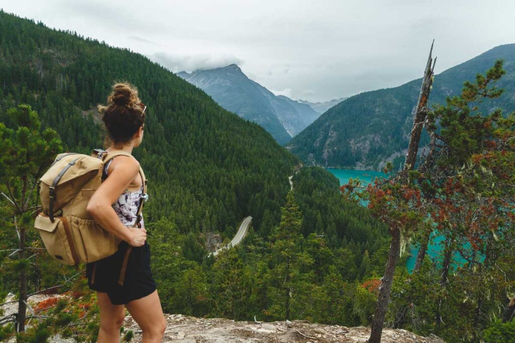 Hiker on Thunder Knob Trail overlooking Diablo Lake in Washington