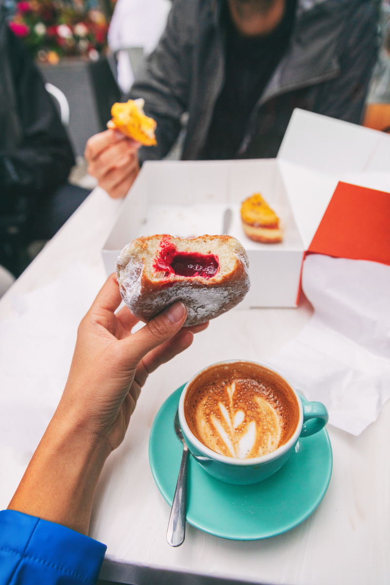 Eating a donut with coffee in one of many Seattle's Cafes