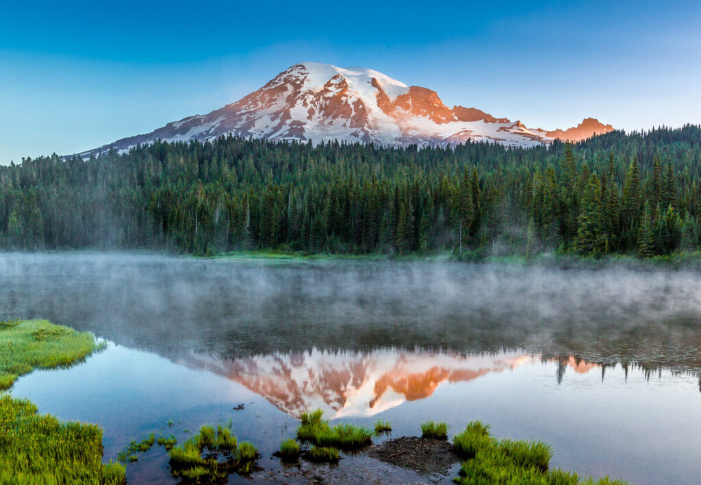 See Mount Rainier reflected on the lake on a day trip from Seattle.