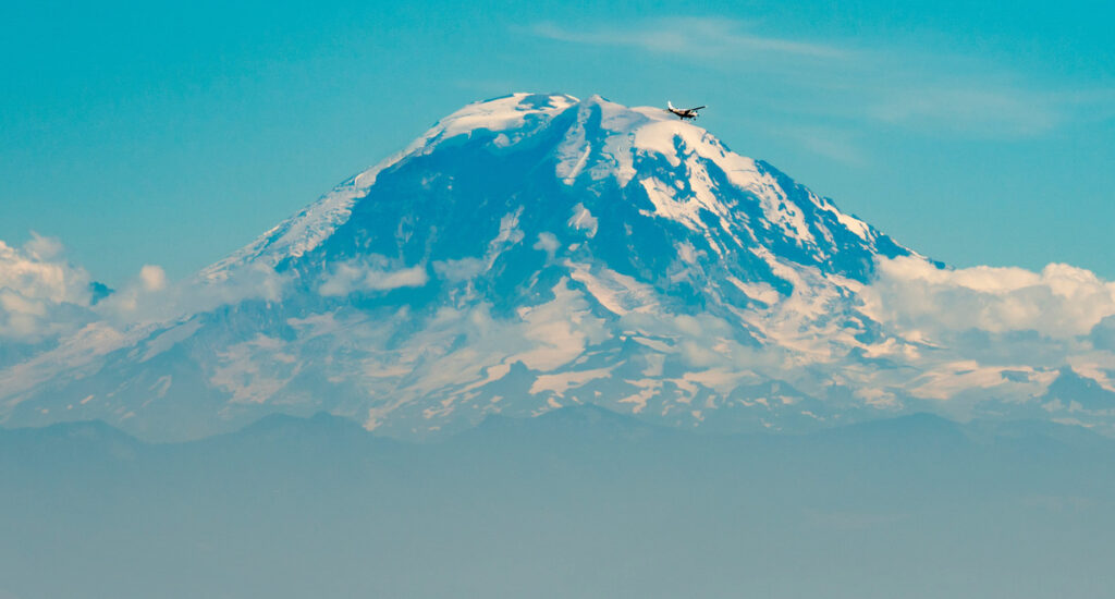 Plane flying in front of Mount Rainier on a Seattle tour