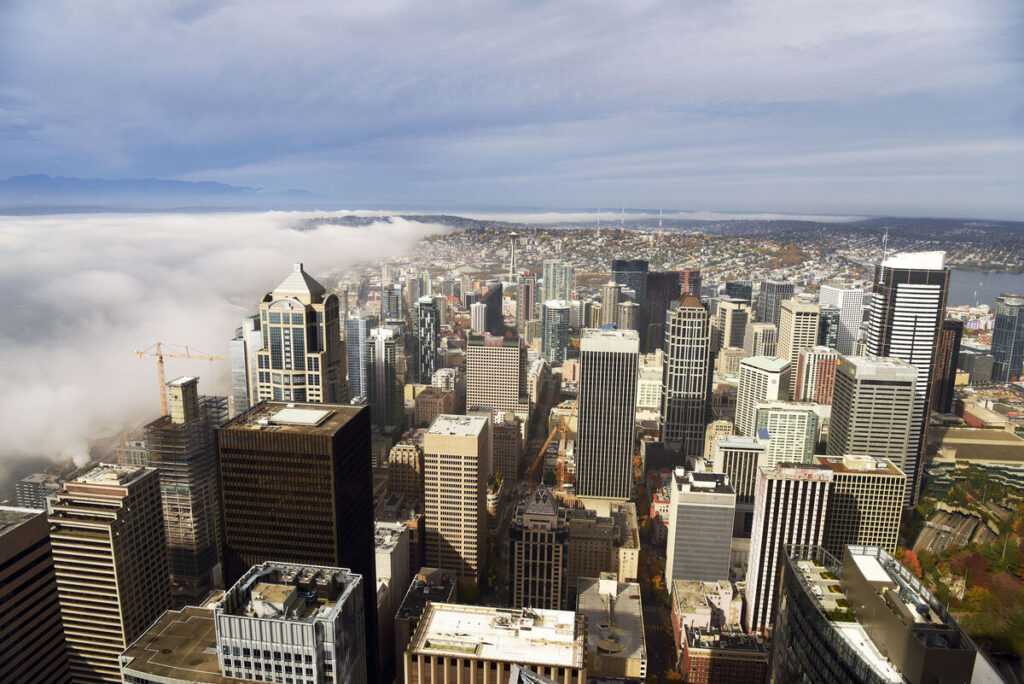 Aerial view of Seattle in the fog on Seattle tours