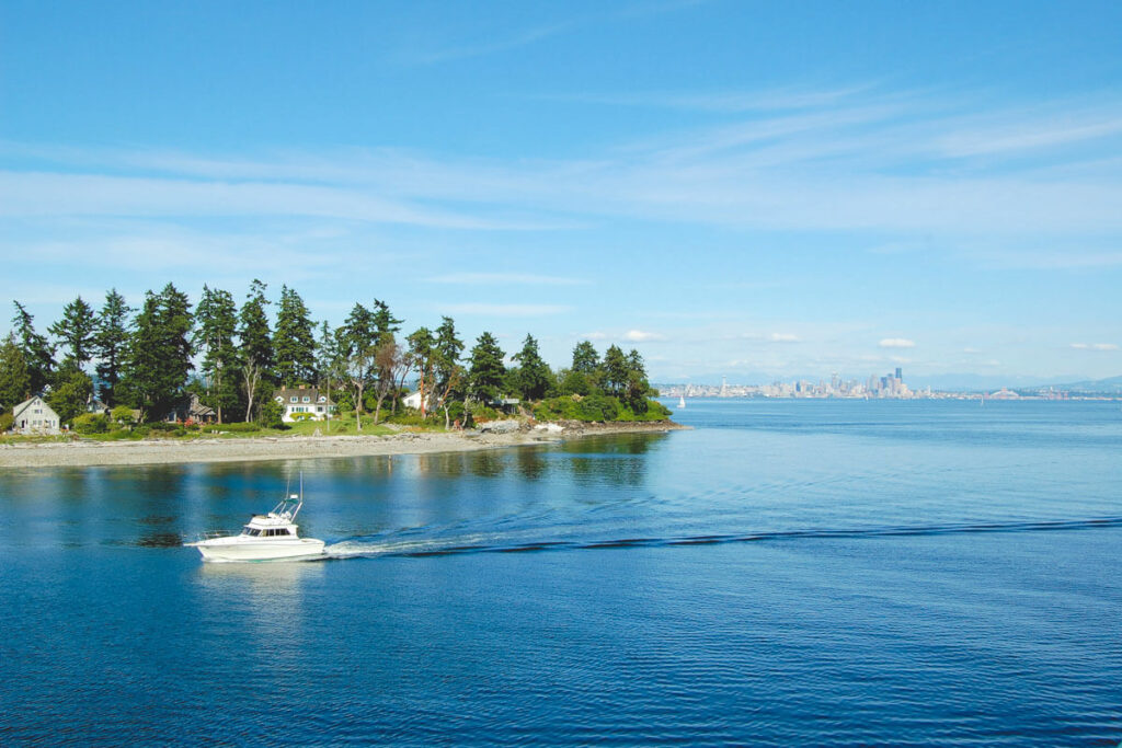 Boat in front of Bainbridge Island, one of the best day trips from Seattle