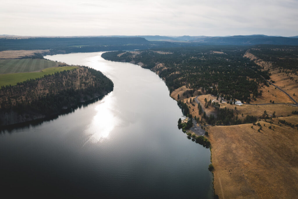 An aerial shot of Lake Spokane campground next to the river in Riverside State Park.