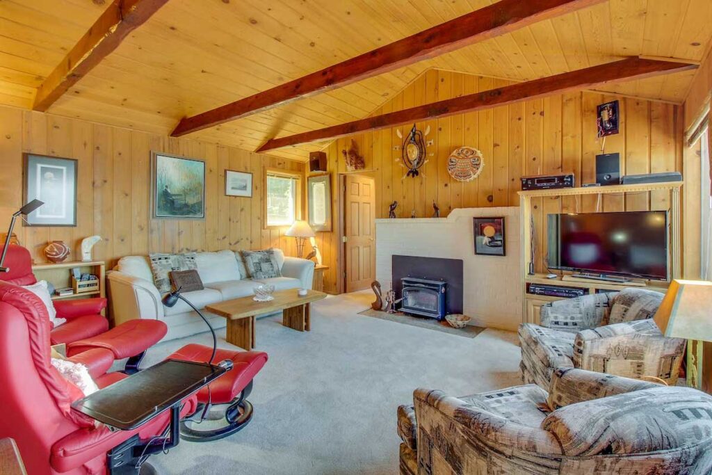 A wooden alpine designed living area in the cozy ocean-front cabin.
