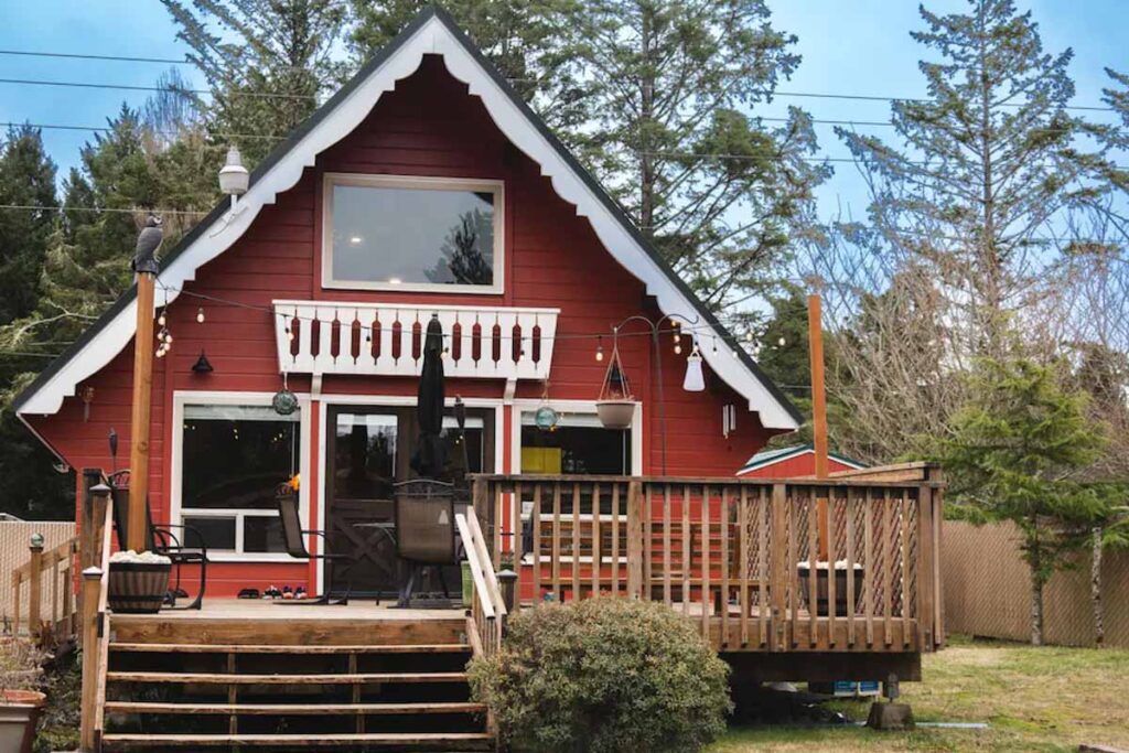An exterior look at the red wood and decorative finishings of the Red Pearl Cabin in Washington.