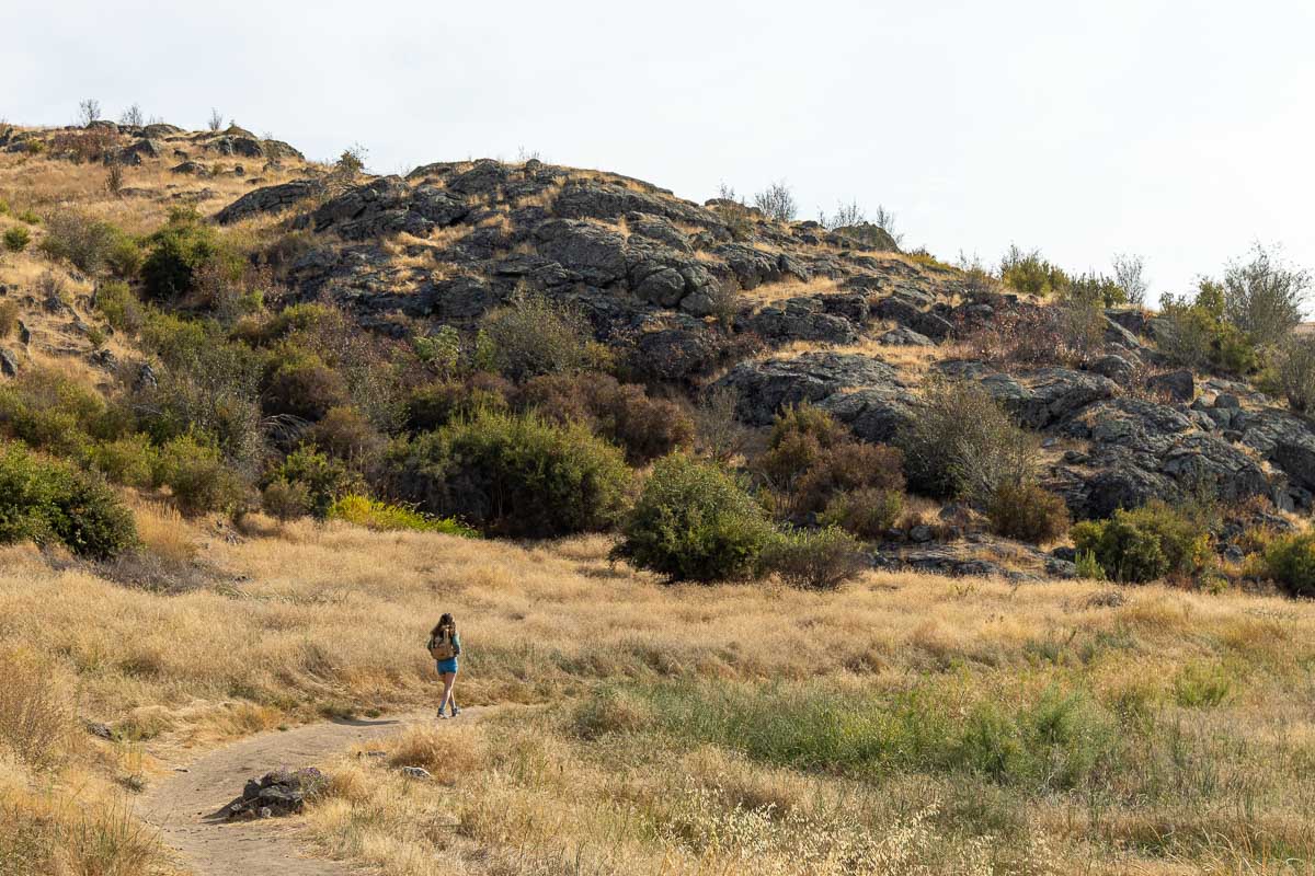 woman hiking Saltese Uplands Conservation Area