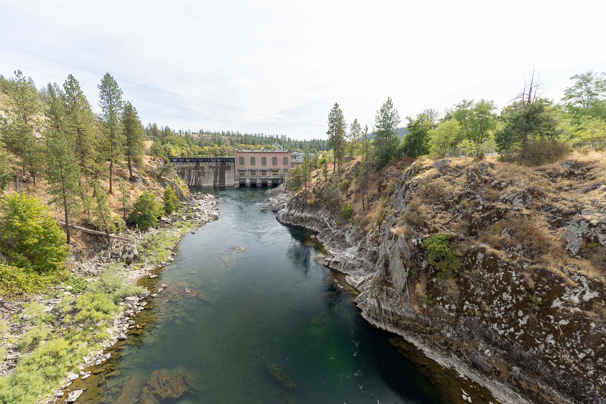 Spokane River Centennial Trail views over bridge of river and dam.